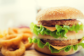 Image showing close up of hamburger or cheeseburger on table