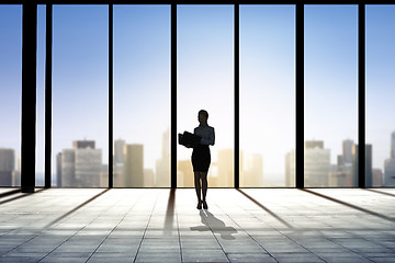 Image showing silhouette of business woman with folders