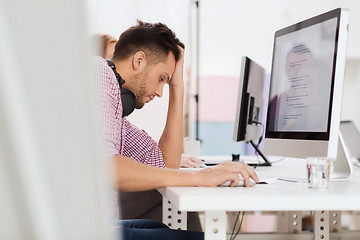Image showing stressed software developer at office