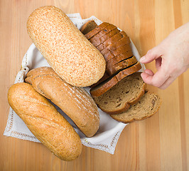 Image showing Freshly baked bread with homespun fabric 