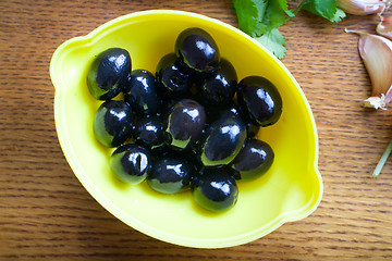 Image showing Fresh olives  wooden background. 