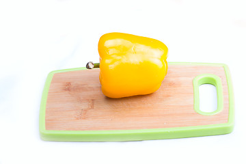 Image showing yellow  paprika on wooden board