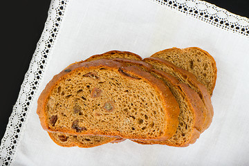 Image showing Freshly baked bread with homespun fabric 