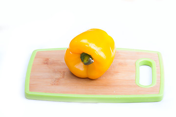 Image showing yellow  paprika on wooden board