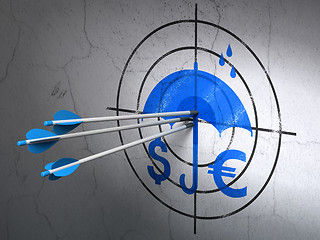 Image showing Protection concept: arrows in Money And Umbrella target on wall background