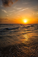 Image showing Ocean sunset with waves