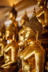 Image showing Golden Buddha statues in buddhist temple