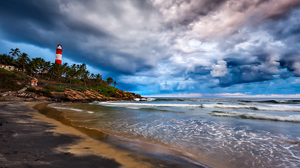 Image showing Gathering storm, beach, lighthouse. Kerala, India