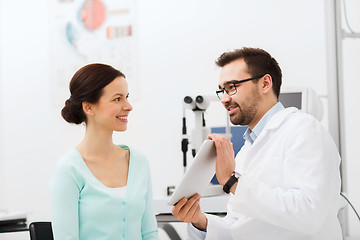 Image showing optician with tablet pc and patient at eye clinic