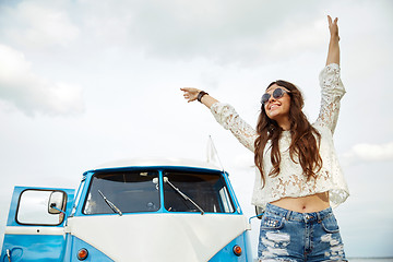 Image showing smiling young hippie woman in minivan car