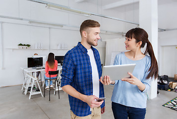 Image showing couple with smartphone and tablet pc at office