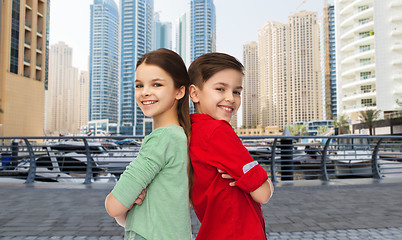 Image showing happy boy and girl standing together