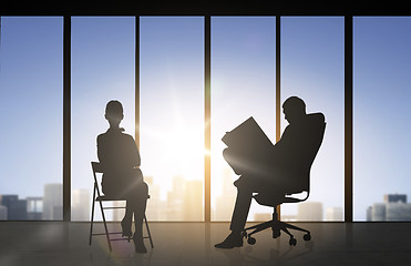 Image showing silhouette of business people working at office