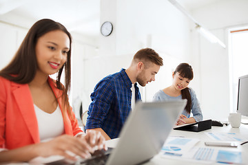 Image showing creative team with tablet pc and papers at office