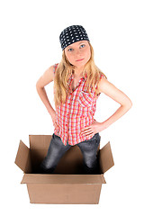 Image showing Girl in a cardboard box, looking up