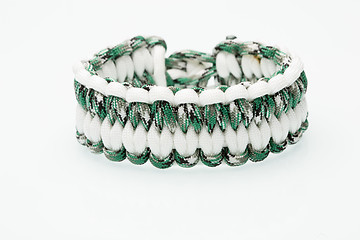 Image showing green braided bracelet on white background