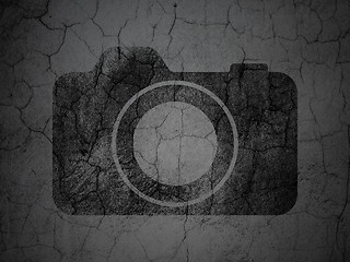 Image showing Vacation concept: Photo Camera on grunge wall background