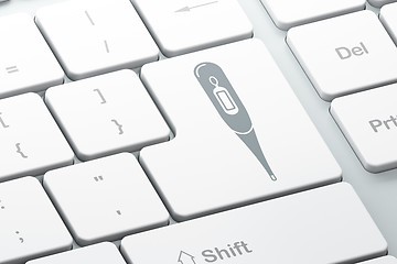 Image showing Healthcare concept: Thermometer on computer keyboard background