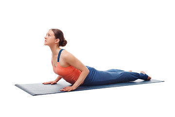 Image showing Sporty fit yogini woman practices yoga asana bhujangasana 