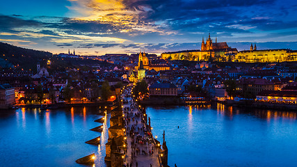 Image showing Night view of Prague castle and Charles Bridge over Vltava river