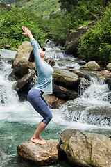 Image showing Sorty fit woman doing yoga asana Utkatasana 