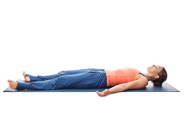 Image showing Sporty fit yogi girl relax in yoga asana Savasana