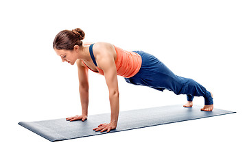 Image showing Young fit sporty woman does Hatha yoga plank asana