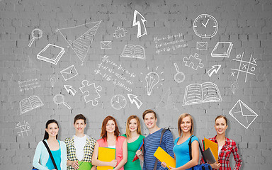 Image showing group of teenage students with folders and bags