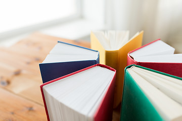 Image showing close up of books on wooden table