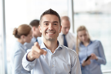 Image showing group of smiling businesspeople meeting in office