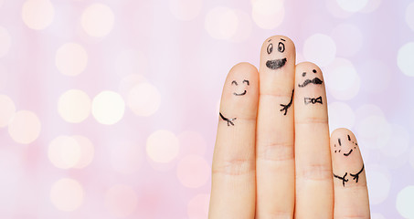 Image showing close up of four fingers with smiley faces