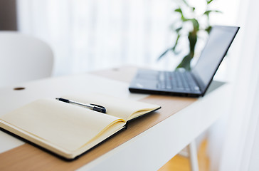 Image showing notebook and laptop computer on office table