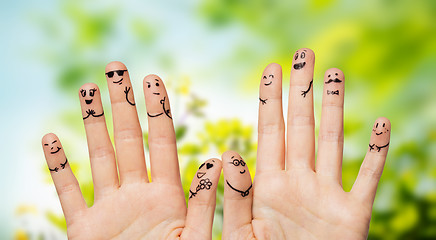 Image showing close up of hands and fingers with smiley faces