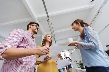 Image showing creative team on coffee break talking at office