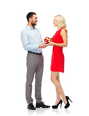 Image showing happy couple with red heart shaped gift box