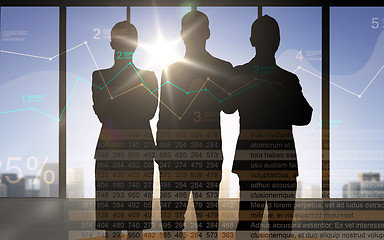 Image showing business people silhouettes with chart and numbers