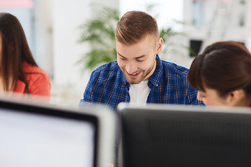 Image showing happy creative team or students working at office