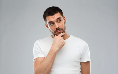 Image showing man thinking over gray background