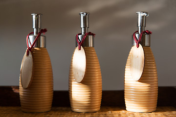 Image showing close up of liquid soap or body lotion at bathroom