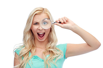 Image showing happy young woman with magnifying glass