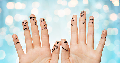 Image showing close up of hands and fingers with smiley faces