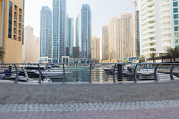 Image showing Dubai city seafront or harbor with boats