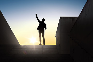 Image showing silhouette of business man with over sun light