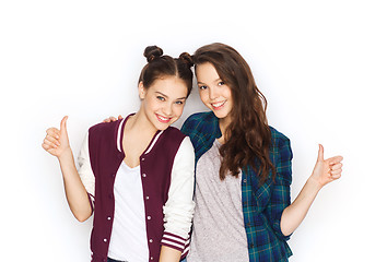 Image showing happy smiling teenage girls showing thumbs up