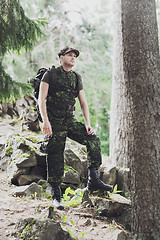 Image showing young soldier with backpack in forest