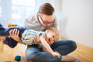 Image showing father with son playing and having fun at home