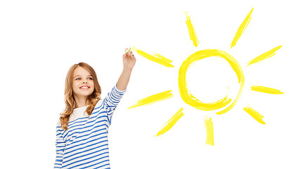 Image showing girl drawing big sun in the air