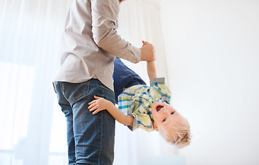 Image showing father with son playing and having fun at home