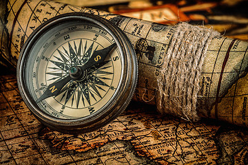 Image showing Old vintage compass on ancient map