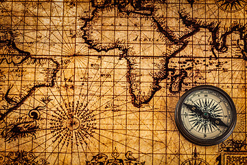 Image showing Old vintage compass on ancient map